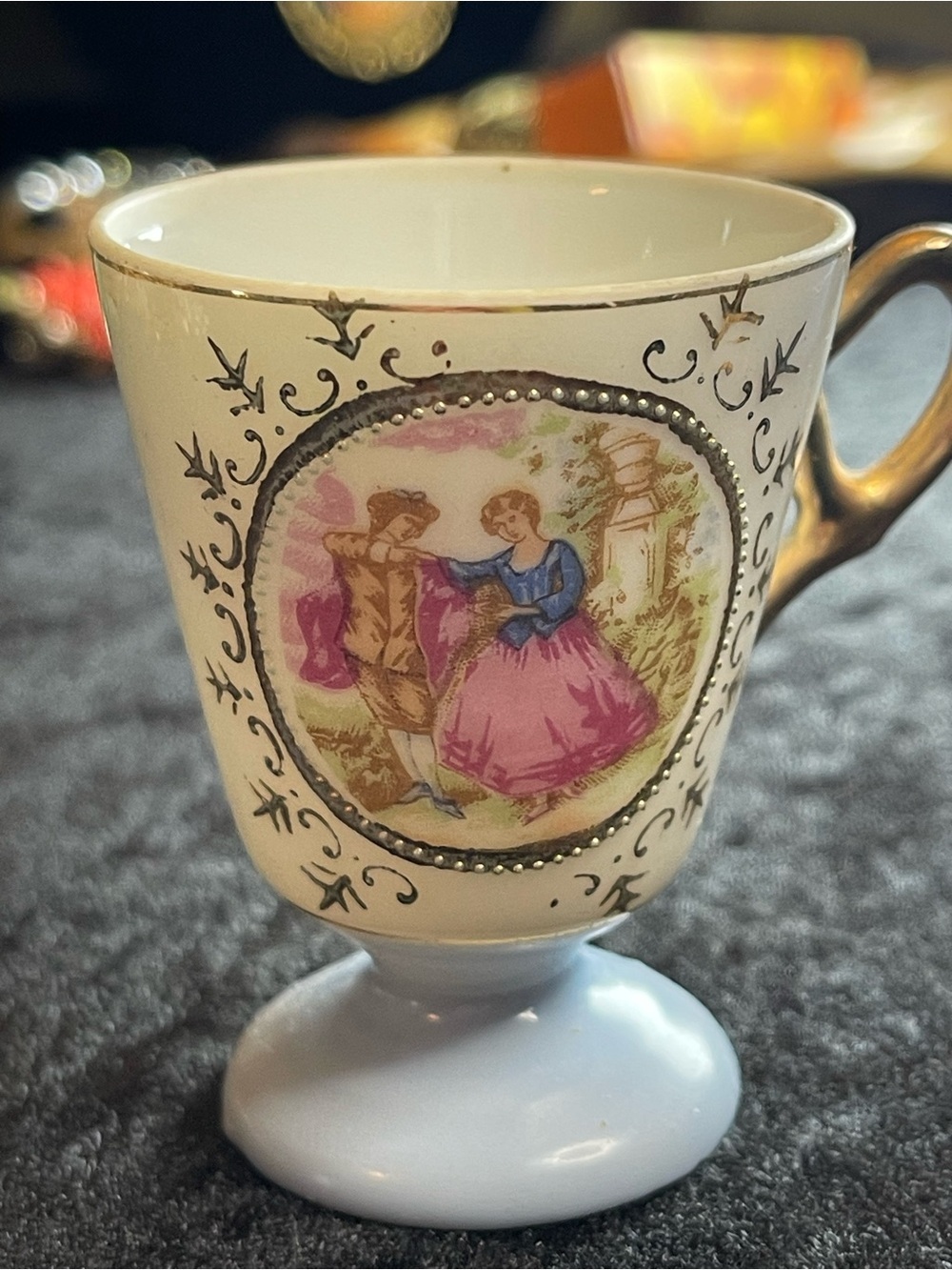 Handpainted mid-century Japanese porcelain demitasse cup.